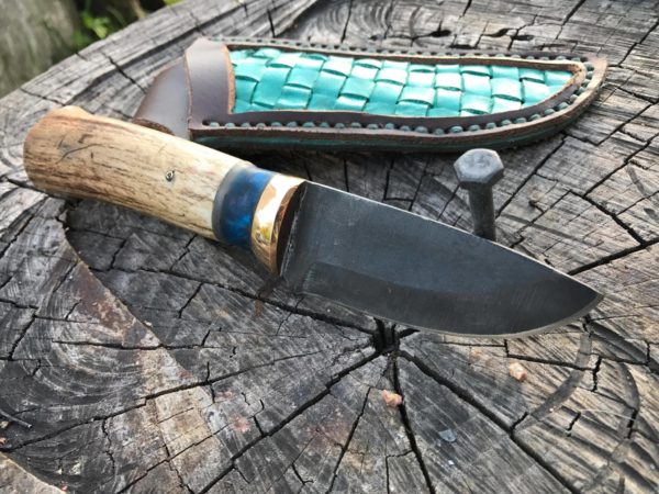 Deaf knifemaker Buddy Thomas sold this knife for $575.