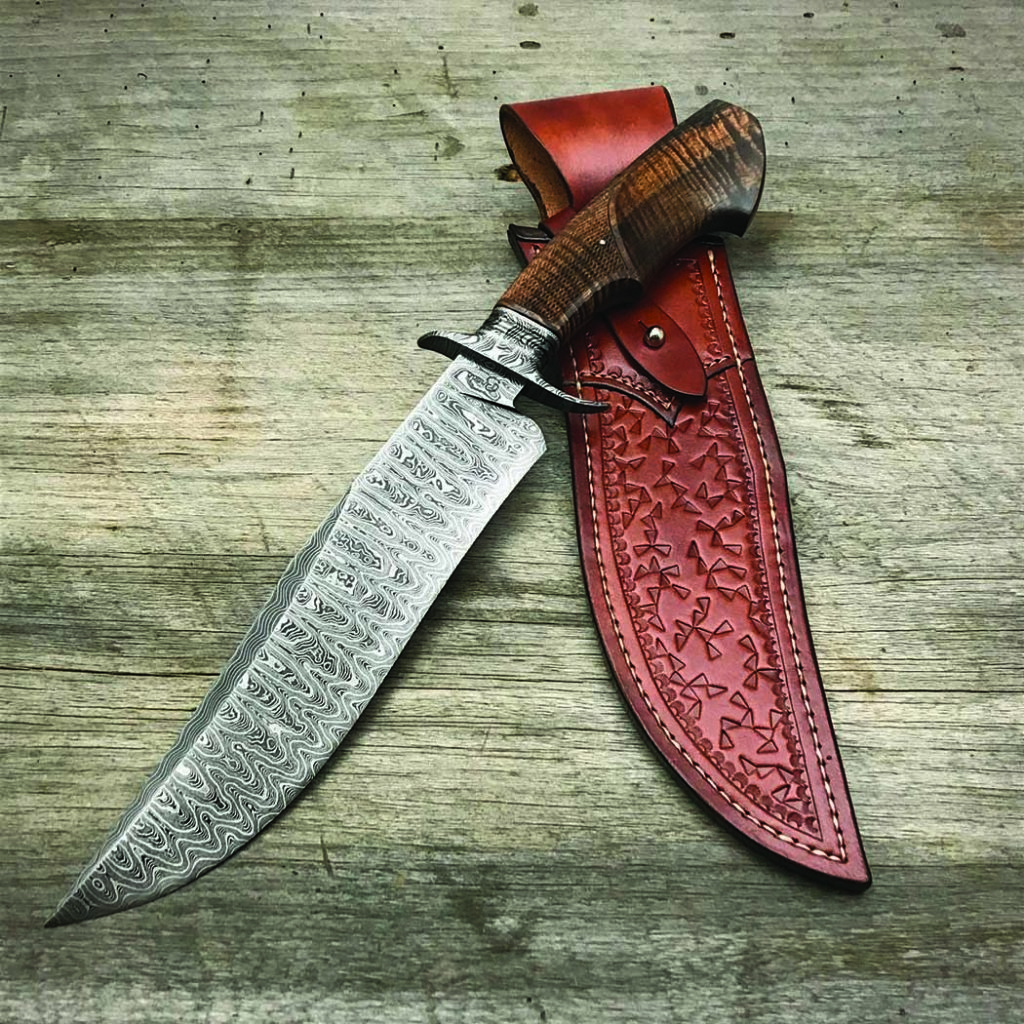Another nine-and-a-halfer, Ben Brea’s Forged Stag Bowie has a ladder-pattern damascus blade and a checkered koa handle. The superlatively executed custom bowie knife comes with a custom leather sheath. Breda set the price of a similar knife at $2,000.