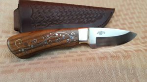 Devin Bliss is used to working with wood so the walnut in this 3.75-inch Bobcat knife is beautiful to look at and hold.