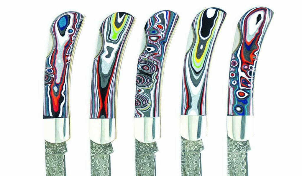 Fordite car paint handle material adds a fun flair to this series of Santa Fe Stoneworks 3-inch lock-back folders