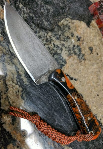 This black and orange knife by Patriot Horde Knives sport scary scales by 8th Dimension Concepts.
