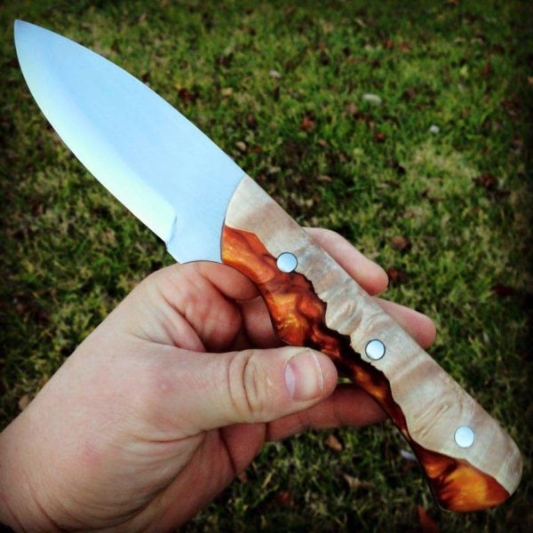 This Bushie by Bill Dudek pairs maple burl in a flame-y Magma color casting.