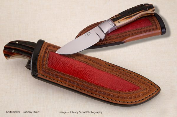 Johnny Stout's drop-point skinner comes with a custom leather sheath with ostrich inlay.