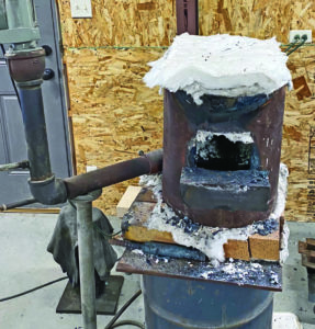 “My propane forge is homemade and the burner is over 20 years old. It is a vertical, Don Fogg design, lined with
ceramic wool lining. Since 99 percent of my knives are damascus steel,” Rick wrote, “they begin in this forge.”