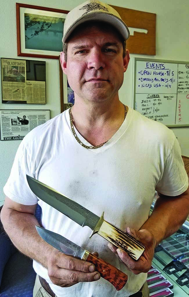  Murray Carter holds the last two knives he made of WTC steel as part of a special fundraising project that included FDNY343 (fdny343.org) and Building Homes For Heroes 