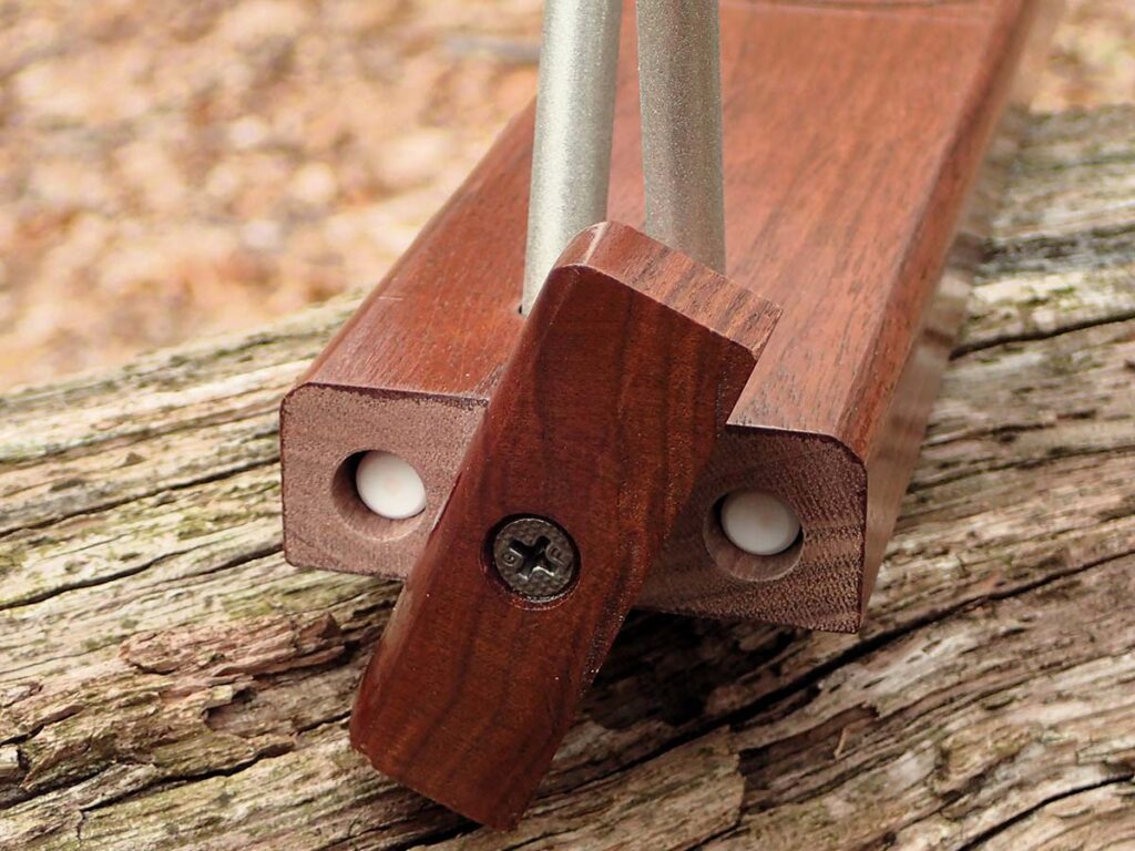 The A.G. Russellās ceramic rods store in a walnut base with a wooden gate, while a plastic slip and cap protect the diamond rods against weather and damage from other gear.