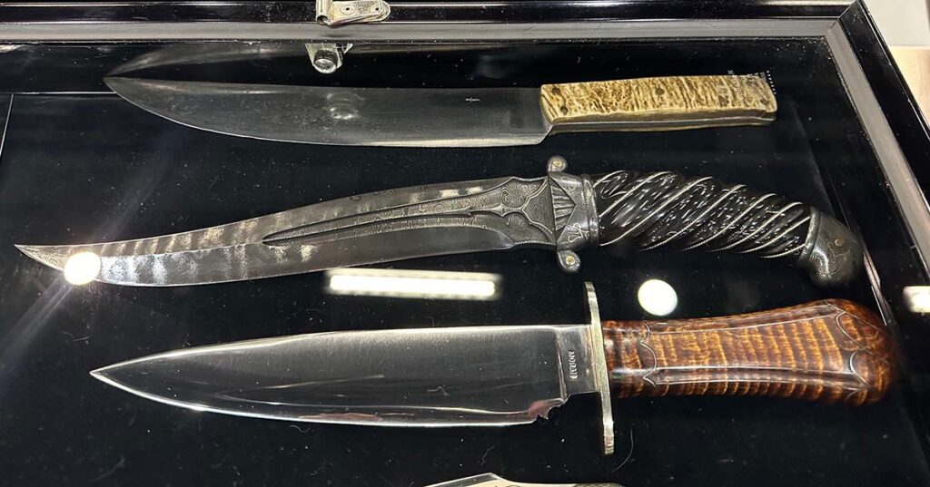 From top, knives from Hall of Famer Bill Scagel, CAS and Hall memeber Bill Moran. Imagine seeing so many great creations in one case. Through the years, it's become commonplace at BLADE Show. (Dave Ellis image)