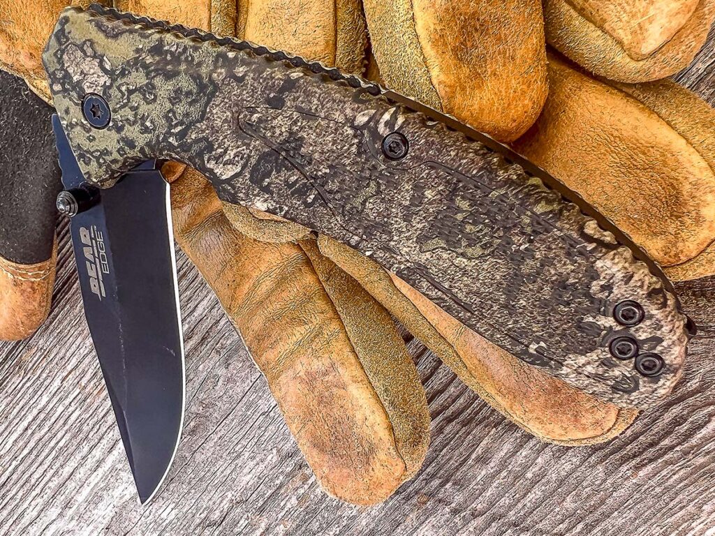 The Bear & Son knife’s handle has textured grip panels for hand traction, as well as traction notches around the perimeter for an excellent all-weather grip.
