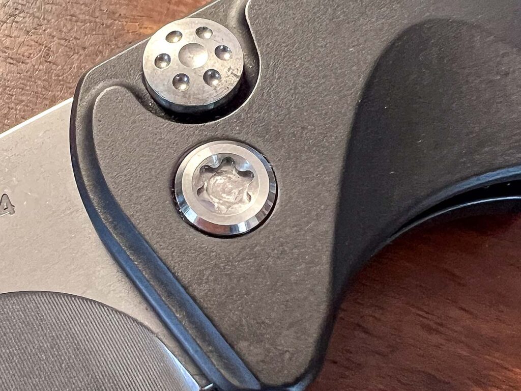  The lock release/firing button of the Medford Knife & Tool Smooth Criminal is domed and sports holes reminiscent of a car hubcap. It’s a nice styling addition to an area most manufacturers ignore.  