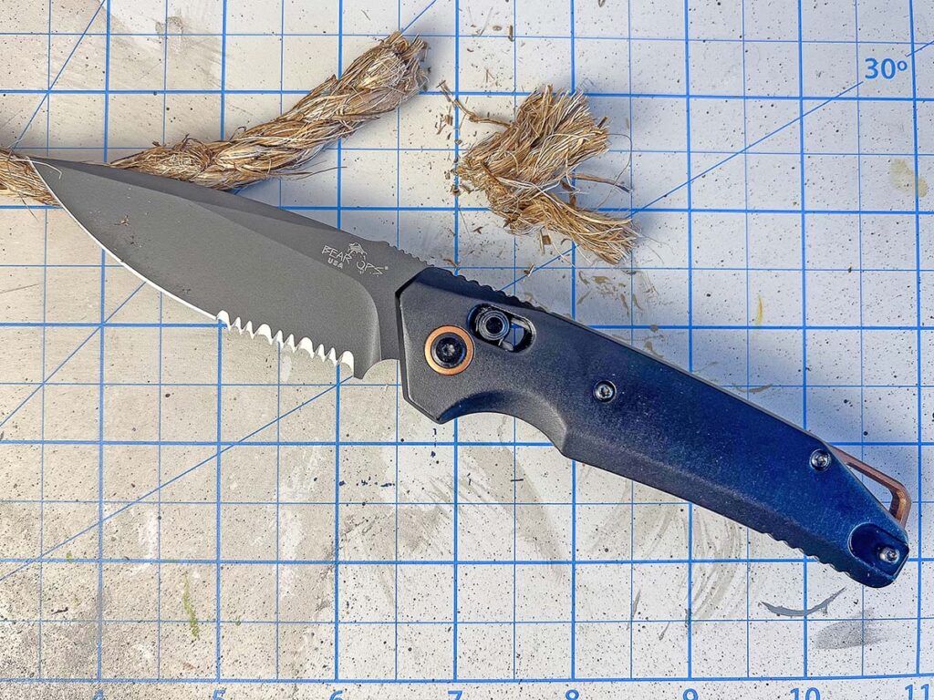 The part serrated blade of the Bear Ops KATAKT II offers cutting versatility and the option to use the serrations for parting tougher materials like cardboard or rope.