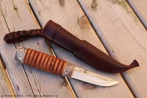Roman Kislitsyn designed this knife with a stacked birch bard handle for feel and warmth..