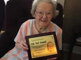 Betty Dowell accepts Ted Dowell's HOF award