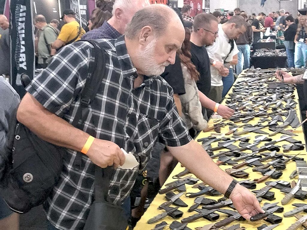 Lots of folks handled lots of knives at the TOPS Knives booth.