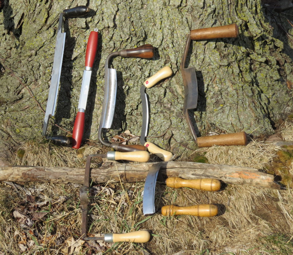 Top row, from left: a German-style drawknife made in Western Germany, Mora push knife, English-style drawknife, Flexcut 5-inch drawknife and a cooper’s knife. Bottom row, same order: Round drawknife and a chair maker’s scorp.