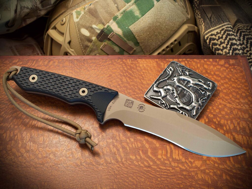 According to Rob Cude, something like the Spartan Ronin Shinto with a recurve blade, long edge and a bit of belly for utility jobs would be on Bowie’s hip. Blade steel and length: CPM MagnaCut stainless and 5 5/8 inches. Country of origin: USA. MSRP: $385-$420.