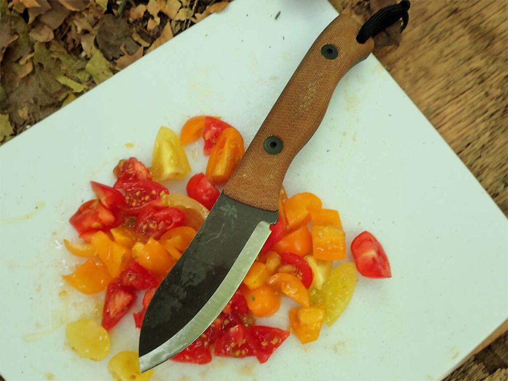 In the Adirondacks (upper right), the author prepared food for the camp using the KBK Cub-Muk. Proving the Scandi blade can slice tomatoes and process food.