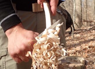Start near the top and carve down with the knife tip angled slightly upward to make a feather stick. This creates curls and reduces slicing resistance.