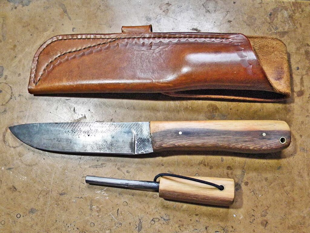 A leather sheath and a ferrocerium rod with a matching handle complete the outdoor package.