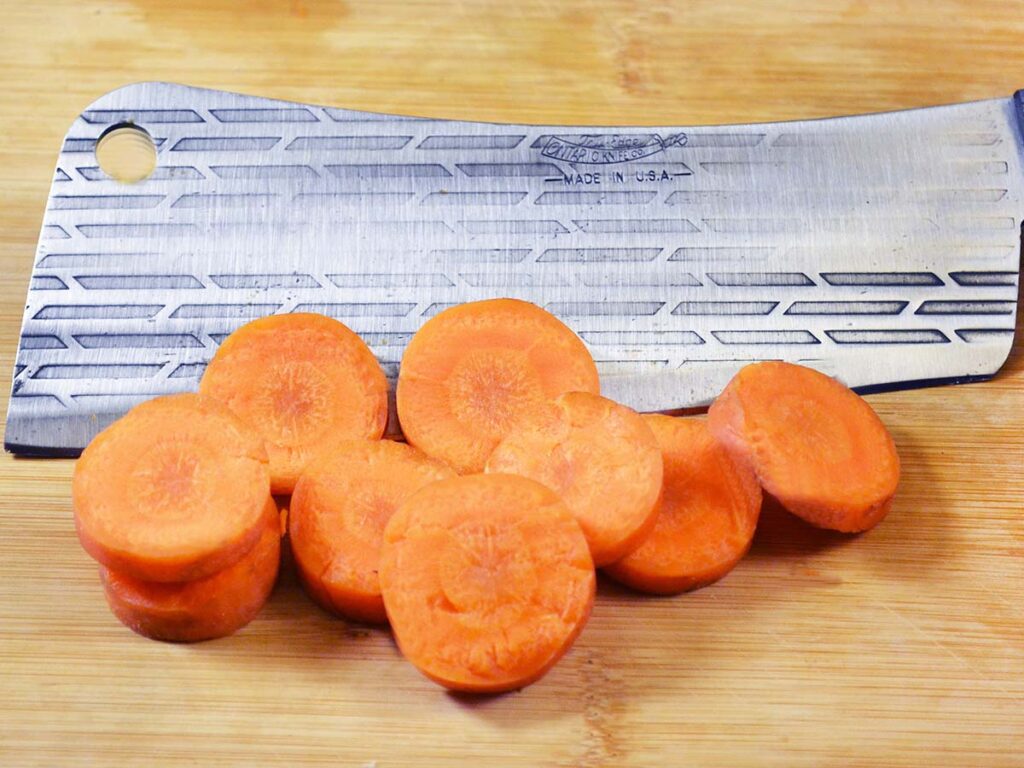 Cutting thick carrots across the grain can be tough on many kitchen knives but was easy for the Ontario Old Hickory 76 Cleaver.
