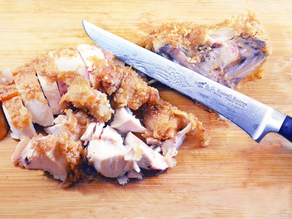 The A.G. Russell relieved the chicken breast of its hard-shell-bone understructure pronto. “Fowl such as chickens retain their juices and flavor much better when cooked on the bone,” the author noted. “Here the chicken breast is removed, sliced and ready to eat.”