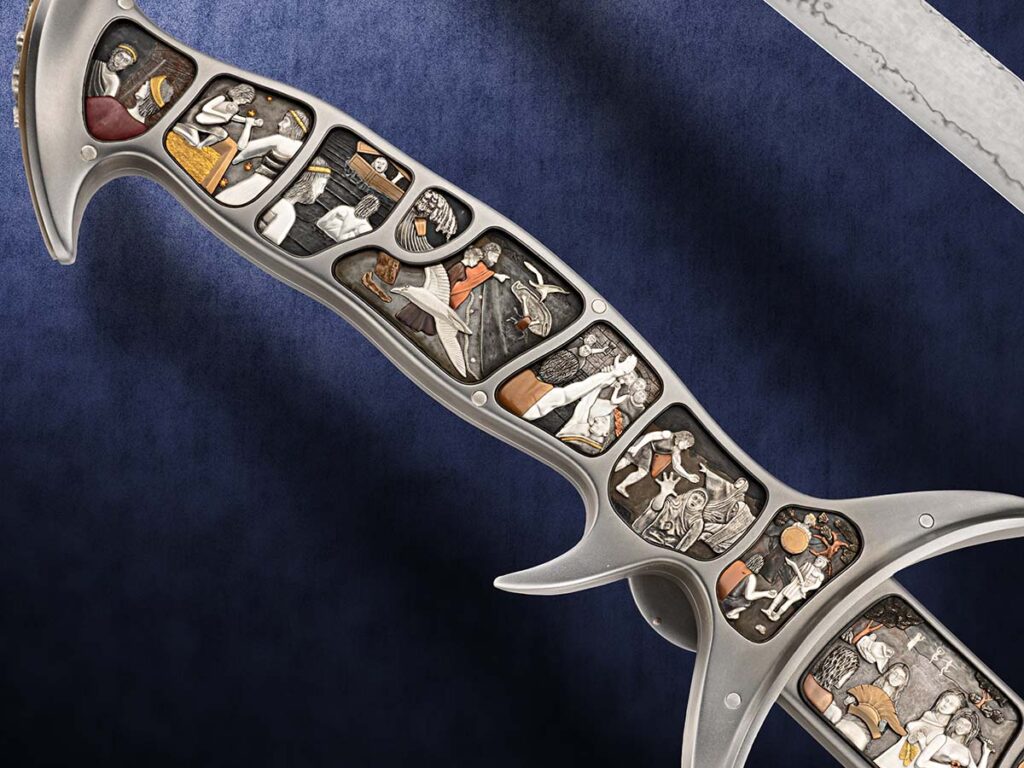 The Guardian Sword handle, with the panels depicting the Greek myth of Perseus and Medusa.