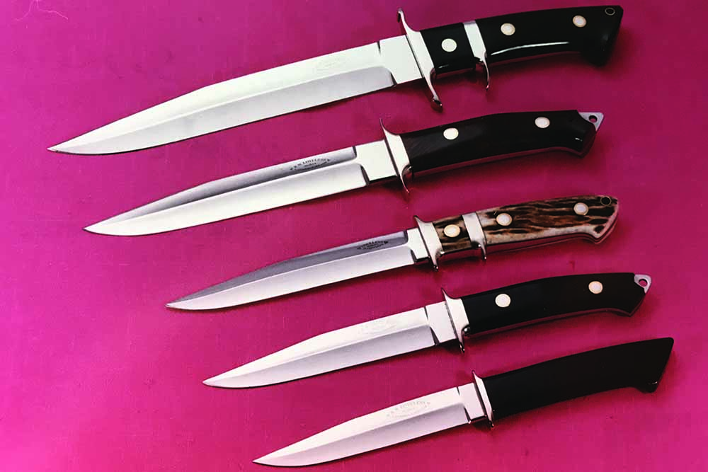 Whenever Harry Archer ordered several Big Bear fighters from Bob Loveless, Loveless said Archer told him to “send the bill to the Pentagon.” From top: the Big Bear Harry broke the tip off inside a Viet Cong soldier during the Vietnam War; tulipwood fighter with skull cracker; Loveless/Johnson sub-hilt with the initials HJA for Harry J. Archer; boot knife with skull cracker; and one Loveless called the Pig Sticker. 