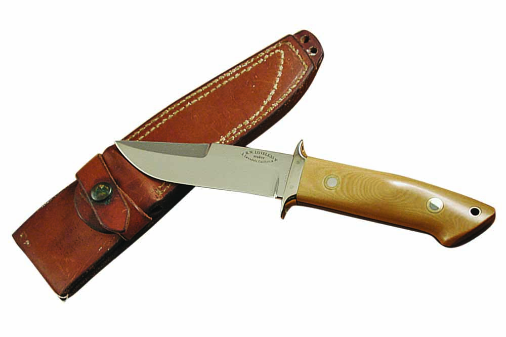 Made in Bob Loveless’s Lawndale, California, shop about 1973-74, this chute knife in ivory Micarta® is stamped BR-003. It was made for the Brass Rail, a famous gun shop in Hollywood, California, where all the celebrity types hung out to see guns and knives. Note the holes in the guard for lashing the knife to a pole to make a spear.