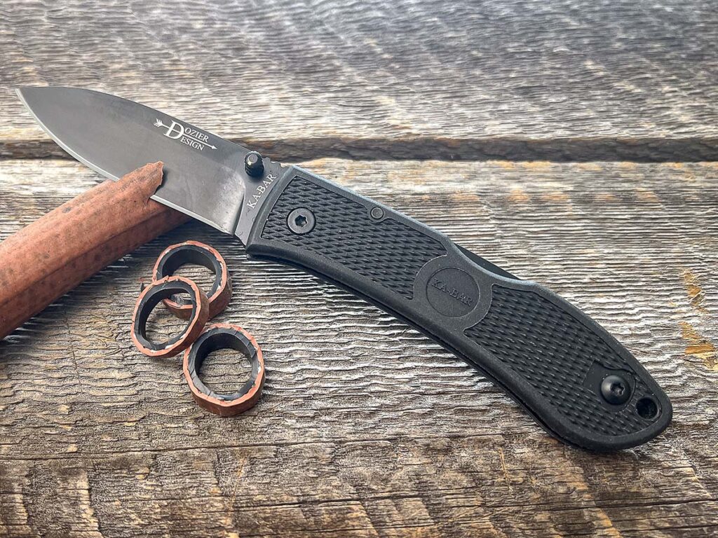 Thicker materials like cardboard and hose are no match for the blade of the SOG Hidaka FX 3V, a Kiku Matsuda design. A slight hint of a recurve to the main cutting edge no doubt helps cutting power. Overall length: 10 inches.