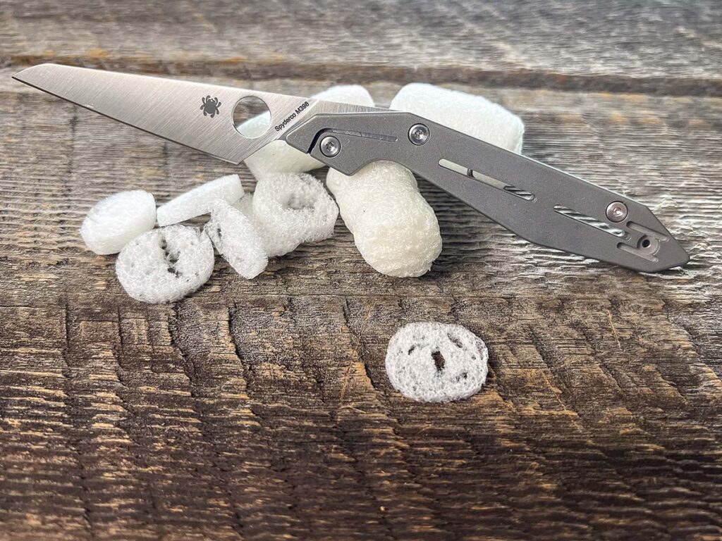 The wharncliffe blade has a full flat grind, which makes the Nand an excellent slicer. Out of the box, the knife cut plastic foam peanuts easily.
