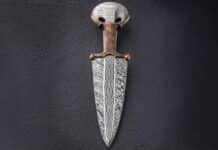 Ryan Breuer, 26, said the primary influence on his one-of-a-kind Relic Dagger is the Bronze Age Egyptian dagger. The shapes on the quillons of Ryan’s knife are carvings in the bronze. While Ryan has made knives for about 10 years, he did not start making them seriously until about eight years ago after graduation from high school. A part-time bladesmith, he works full time as an engineer for a manufacturer making parts for medical devices. (image of Ryan’s knife by SharpByCoop.com)