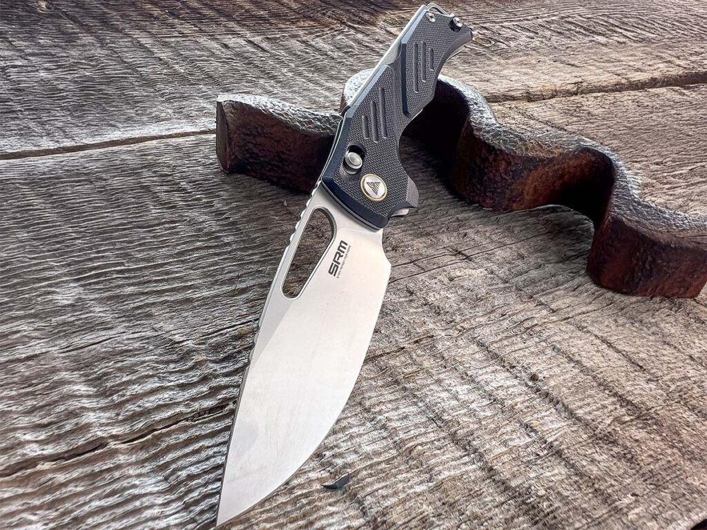 The author stated he likes the extra relief milling done on the G-10 around the lock-release button to promote a better grip when operating the blade of the SRM Mirage.