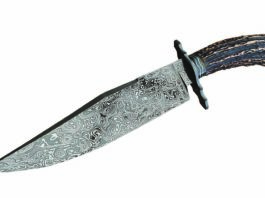 Shawn McIntyre's forged mosaic damascus Sheffield Bowie with a striking presentation stag handle and 9-inch blade. The knife runs 14 inches in overall lenght. Similar knives from McIntyre would command $2,850.