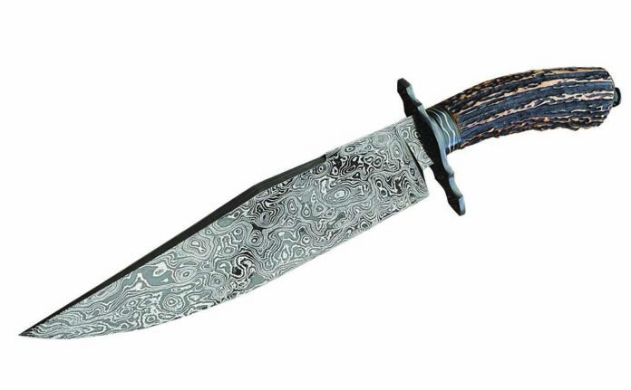 Shawn McIntyre's forged mosaic damascus Sheffield Bowie with a striking presentation stag handle and 9-inch blade. The knife runs 14 inches in overall lenght. Similar knives from McIntyre would command $2,850.