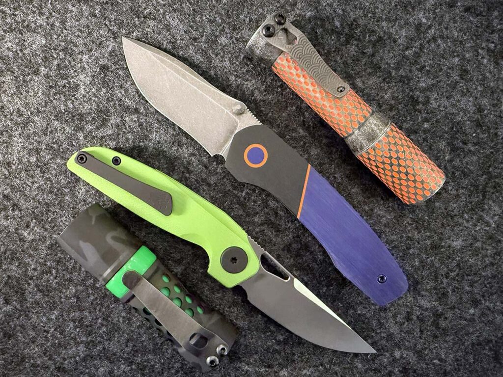  Showcasing unique materials and intriguing designs that draw collectors, this lineup features the (from the top) Dawson MachineCraft Divot Slim, Chad Nell Palisade Sr. (Spooky Edition), HMC Transient 2.9 with Dayglo scales and Barrel 10-1 in aluminum with camo Cerakote and green Turboglow.