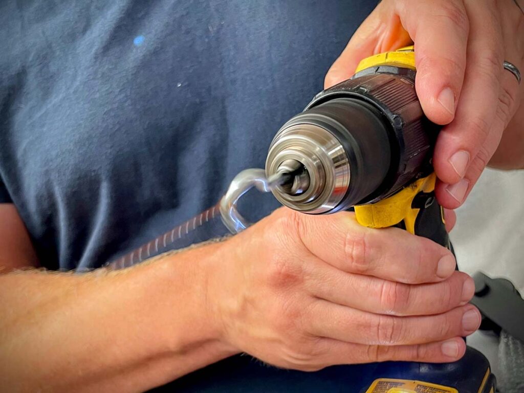 With a hook chucked in a hand drill, hook the resulting large loop, pull it tight and turn on the drill. Keep the tension constant—as you twist the wire it will pull you toward the vise.