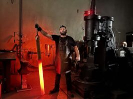 Jesse Harber holds a huge billet of Vegas Forge Damtanium—titanium damascus made with Grade 2 and Grade 5 titanium—after forging it. It was for a customer who wanted a Damtanium sword. “We forged the material to spec,” Jesse wrote, “and then coordinated with Blake Griffith at Griffworx to machine the sword.”