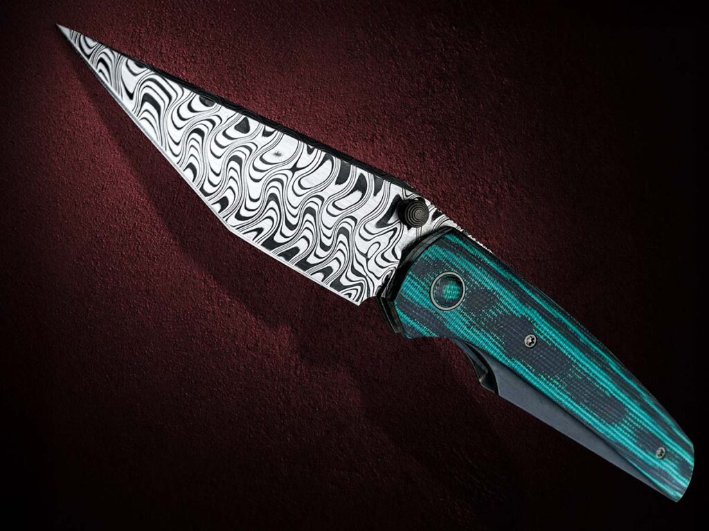 Jake McCoy used Baker’s Zeus stainless damascus for the blade of his folder.