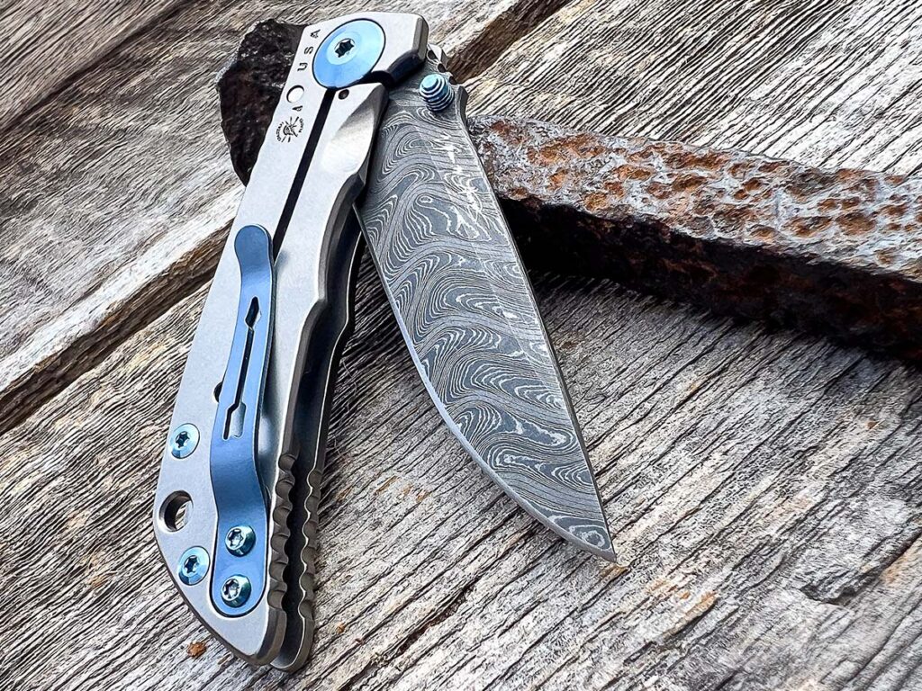 The bead-blast titanium handle of the 3.25 boasts titanium hardware anodized a light blue for an interesting pop of color. 