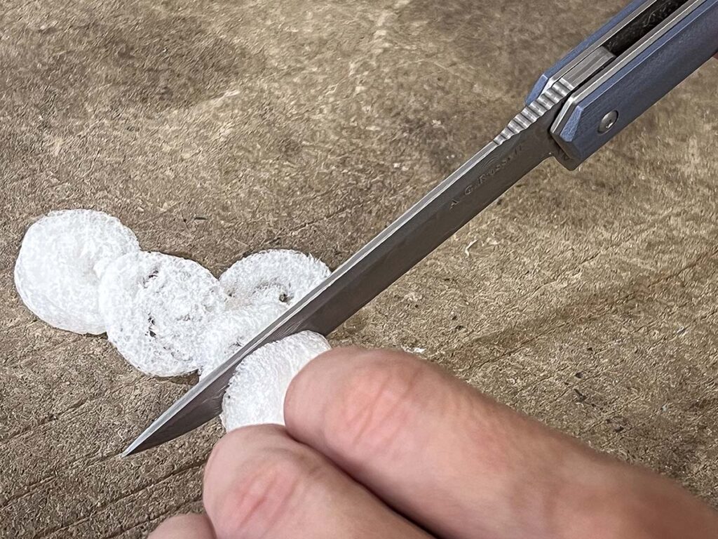 Cutting plastic foam into thin slices was a favorite edge tester of BLADE Magazine Cutlery Hall-of-Fame® member A.G. Russell, and the A.G. Russell Knives Slim Damascus Folder tackled the task with aplomb.