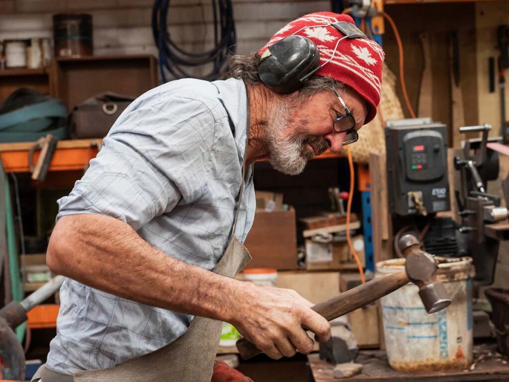 Tony Docherty working in his forge.