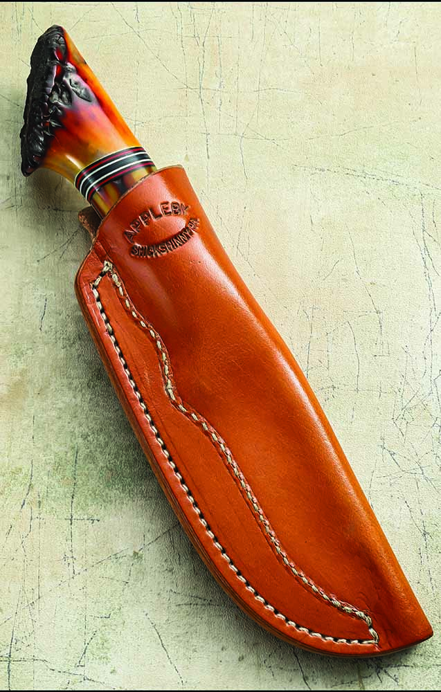 The pouch belt sheath of 8- to 9-ounce leather from Wicket & Craig is also in the Loveless style. Robert is celebrating 25 years of knifemaking. 