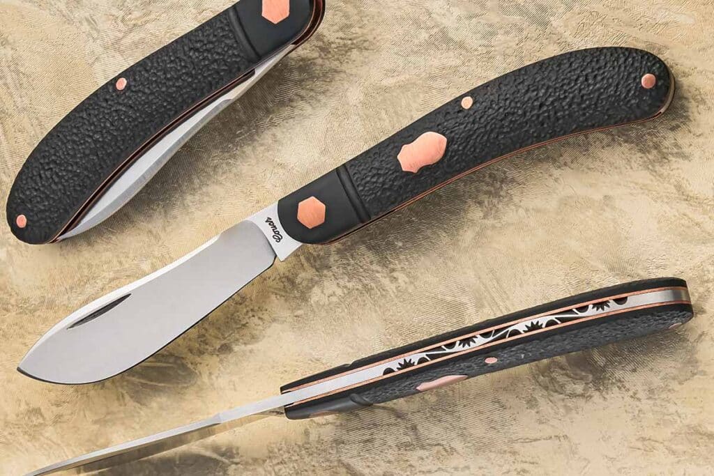 Tanner Couch uses copper to highlight the hardware of the textured black paper Micarta® handle and creative filework that covers only about half the backspring of his shadow pattern rabbit skinner. Closed length: 3.75 inches.