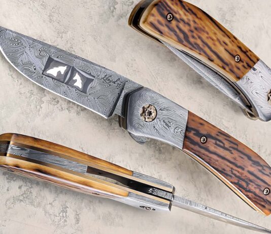 Lloyd Custom Knives’ Osprey is a flipper folder featuring a 3.5-inch hollow-ground blade of "Coat of Arms" Damascus. This 7.5-inch masterpiece utilizes a titanium frame, intricate mosaic Damascus bolsters, and premium mammoth ivory handle scales. (SharpByCoop image)