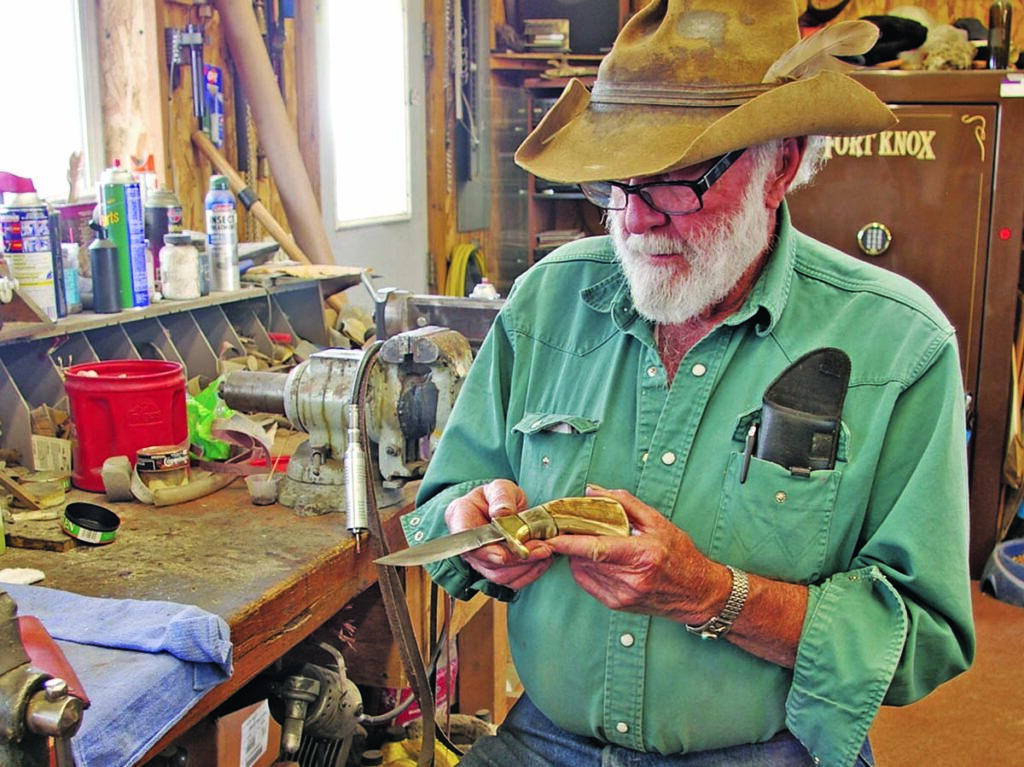 Feeling the handle of a knife against bare skin in the user or maker’s hand is considered the acid test for utility. Ed Fowler cradles one of his trademark sheep-horn handle knives at his shop bench.