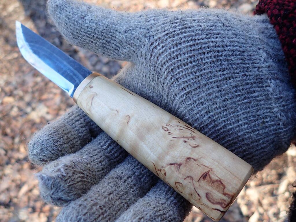 “After hanging out with Anders Haglund, formerly of Helle Knives, I appreciated the idea of a larger handle for mitten manipulation,” Joe Flowers stated. “The legacy of Sami reindeer herders who use large gloves helped him convince me.” The Nordic-style fixed blade is a Marttiini Arctic Carving Knife. (Bolieu image)