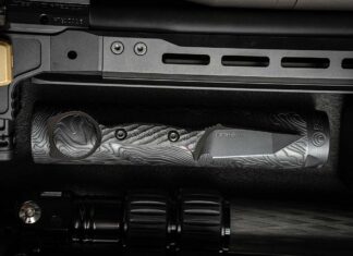 Toor/Silencer Shop Hendrix knife on a flashlight.