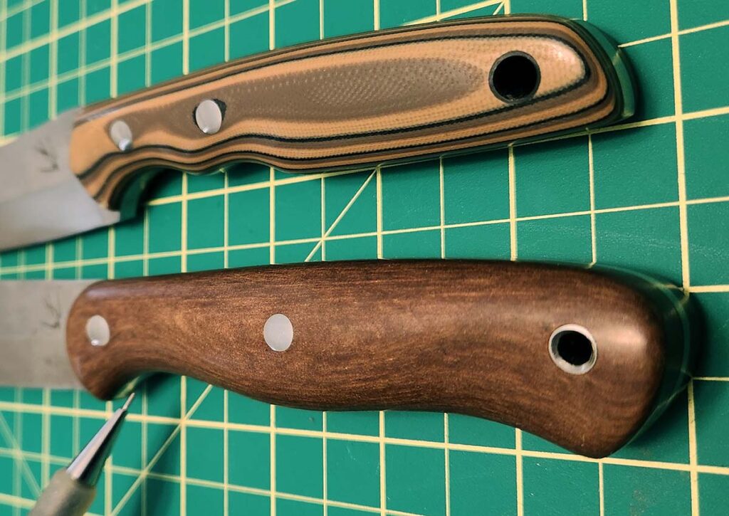 Two Diving Sparrow Knives prototypes. Follow the layering lines built into the material and you can see the flowing contours. The contours not only provide a place to grip but the subtle grooves give your fingers platforms to manipulate the knife in your hand