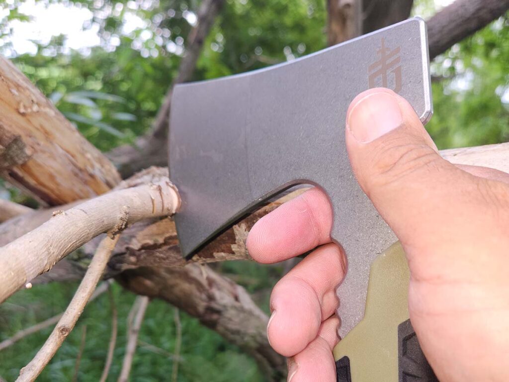 The finger grooves at the top of the Gerber Pack Hacket handle aids grip and control when choking up for detail work.
