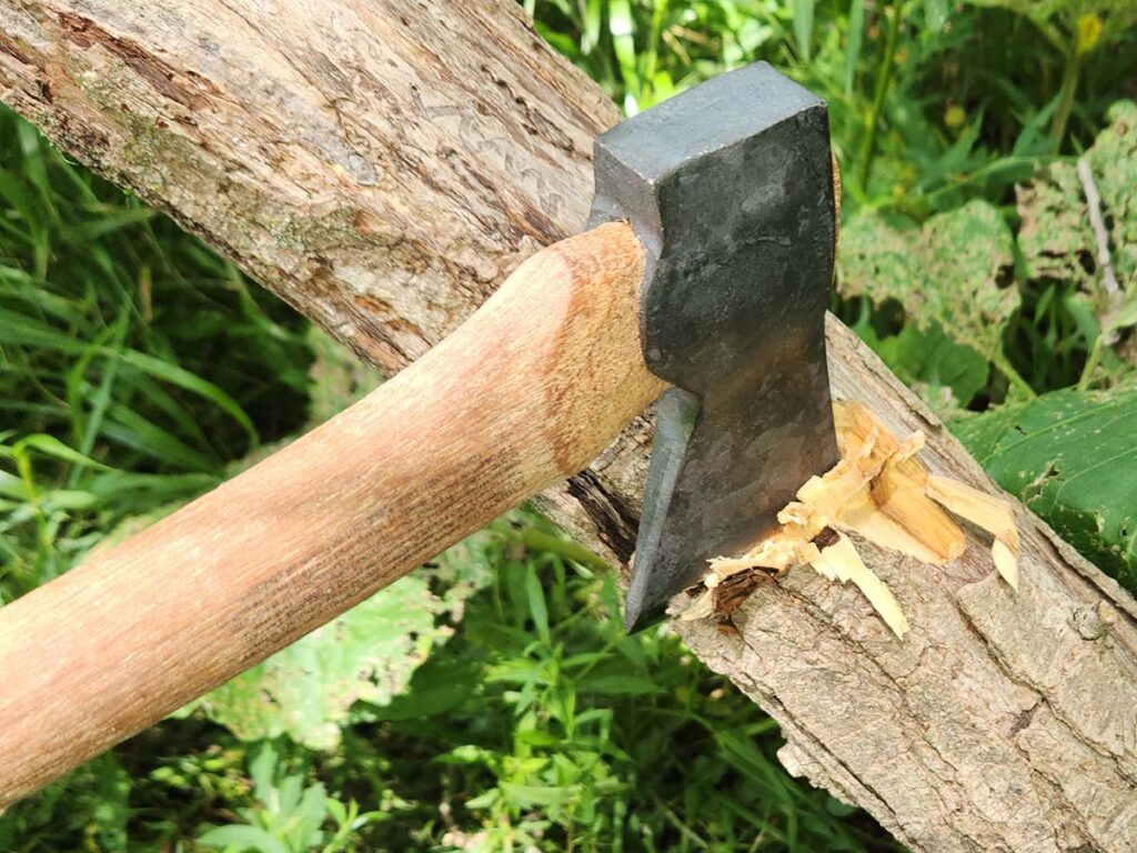 The Hults Bruk may not have a very large cutting edge, but it still packs a wallop. Between the length of the handle and its weight, there is a lot of energy being transferred into a swing.
