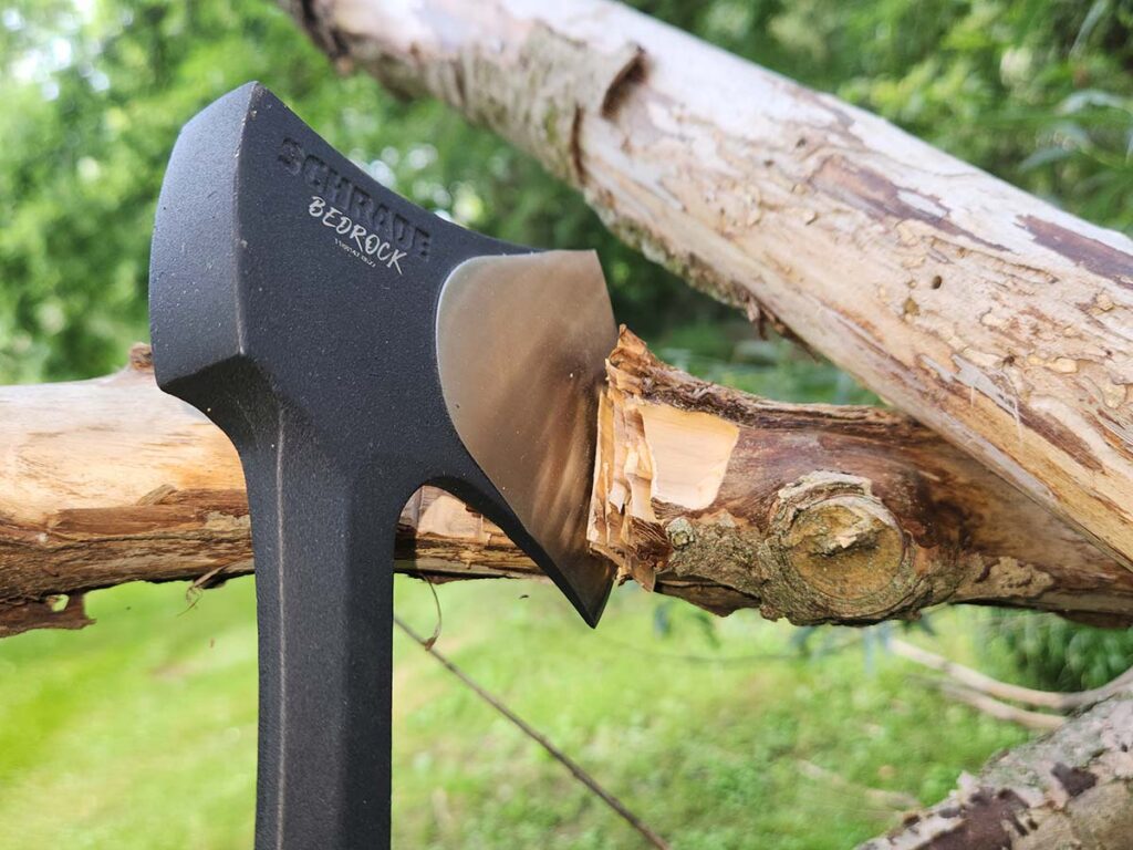 The Schrade Bedrock may be a small hatchet, but it has a good amount of weight coupled with a well-formed bit to pack a thump when you swing it. The rubber overmold on the grip absorbs plenty of the shock. Lastly, there is a good amount of beard to the bit profile so that you can choke up and get behind the edge to do detail work.